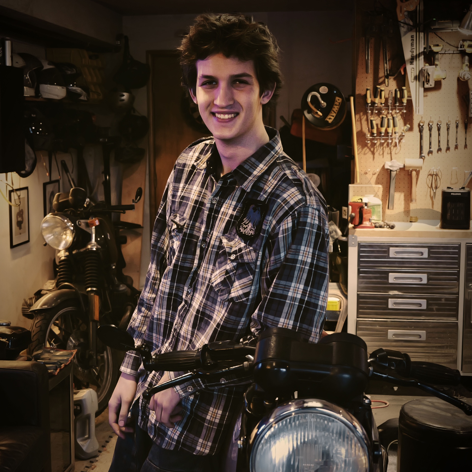 Sebastian Irvine in the garage with his motorcycle